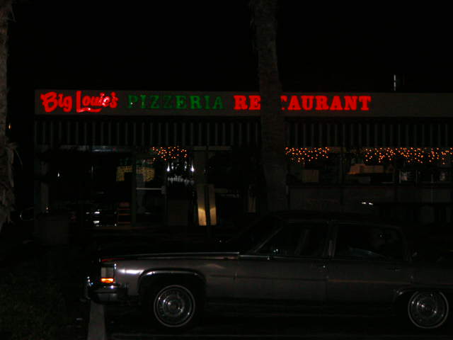 The bar is to the right of Big Louie's