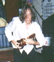 Joe with the evil O shreds a guitar solo