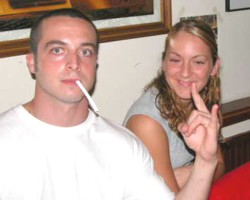 Watch me as I light my cigarette with this magic heavy-metal devil sign.