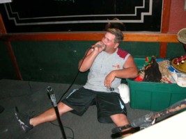 Too drunk to stand but not too drunk to sing.